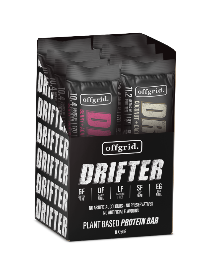 A box of Offgrid Drifter plant-based protein bars in various flavors including Berry + Acai and Coconut + Cacao.