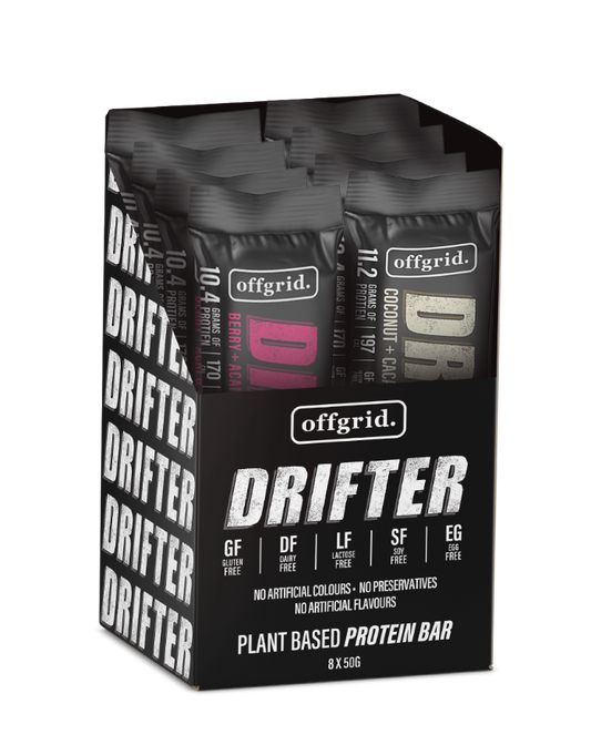 A box of Offgrid Drifter plant-based protein bars in various flavors including Berry + Acai and Coconut + Cacao.